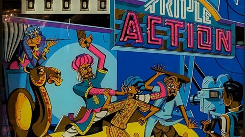 triple-action-bg.jpg backglass